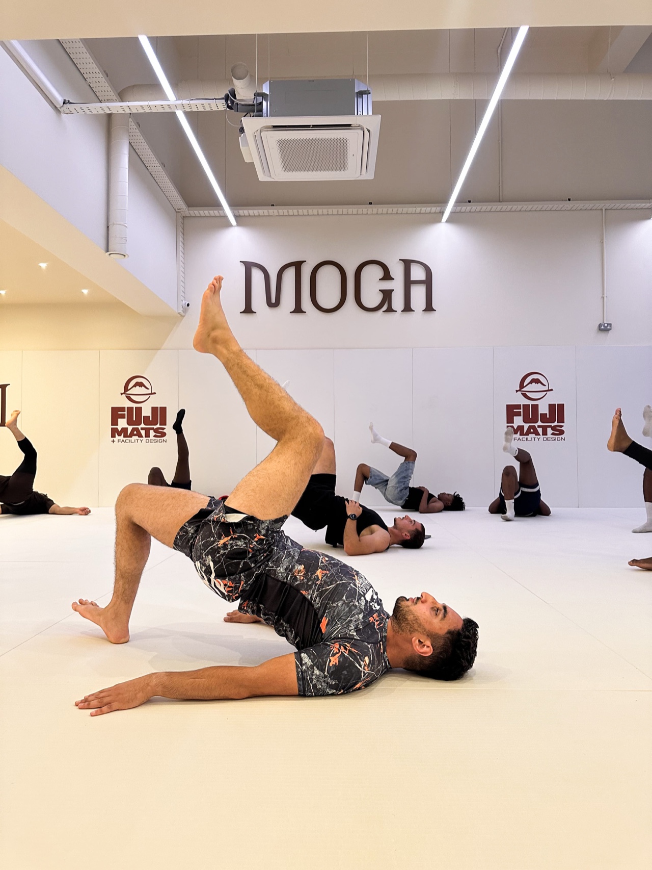 A member training on the mat at MOGA